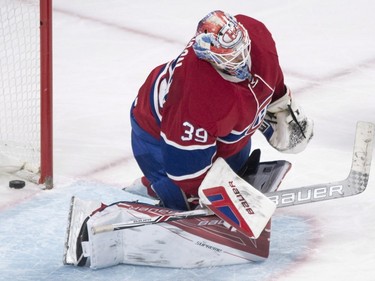 Montreal Canadiens goaltender Mike Condon looks down after being scored on by New York Rangers' Chris Kreider during second period NHL hockey action in Montreal, Saturday, March 26, 2016.