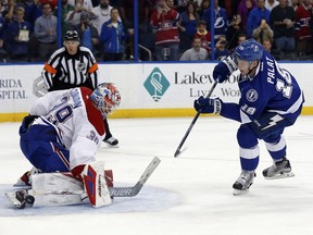 Montreal Canadiens goalie Mike Condon makes a save on a penalty shot by Tampa Bay Lightning's Ondrej Palat, of the Czech Republic, during the second period of an NHL hockey game Thursday, March 31, 2016, in Tampa, Fla.