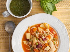 Minestrone, thick with vegetables two kinds of beans and pasta, makes a sustaining supper dish.