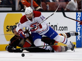 Ryan Garbutt #16 of the Anaheim Ducks battles Tomas Plekanec #14 of the Montreal Canadiens for a loose puck during the second period of a game at Honda Center on March 2, 2016 in Anaheim, California.