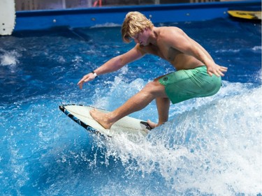 Pro surfer Cheyne Magnusson rides an artificial wave at Oasis Surf on Friday March 25, 2016, in Brossard.