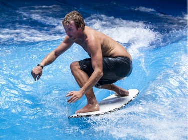 Pro surfer Jamie O'Brien rides an artificial wave at Oasis Surf on Friday March 25, 2016, in Brossard.