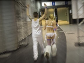 Revellers leave the Bal en Blanc all night dance party at the Bell Centre in Montreal on Monday April 6, 2015.