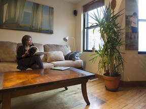 Marie-Aline Vadius in the living room of her apartment. (Pierre Obendrauf / MONTREAL GAZETTE)