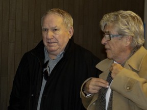 Bernard Trépanier, left,  leaves the Montreal Courthouse with lawyer Pierre Morneau in Montreal on Tuesday February 23, 2016.