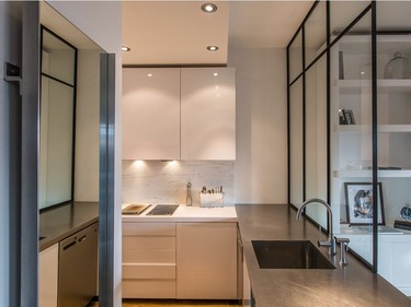Another view of the kitchen and its stainless-steel countertops.  (Dario Ayala / Montreal Gazette)