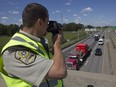 Sûreté du Québec officer Brunot Girard during radar operation on Highway 20 near the Lafontaine tunnel on Thursday July 16, 2015.