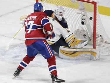 Alex Galchenyuk of the Montreal Canadiens scores his second goal of the game against Robin Lehner of the Buffalo Sabres in the second period of an NHL game at the Bell Centre in Montreal Thursday, March 10, 2016.