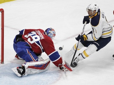 Goalie Mike Condon of the Montreal Canadiens stops Evander Kane of the Buffalo Sabres in the second period of an NHL game at the Bell Centre in Montreal Thursday, March 10, 2016.