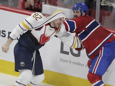 Greg Pateryn of the Montreal Canadiens Marcus Foligno of the Buffalo Sabres fight in the third period of an NHL game at the Bell Centre in Montreal Thursday, March 10, 2016.