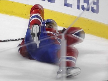 P.K. Subban of the Montreal Canadiens lays writhing on the ice after sustaining an injury against the Buffalo Sabres in the third period of an NHL game at the Bell Centre in Montreal Thursday, March 10, 2016.