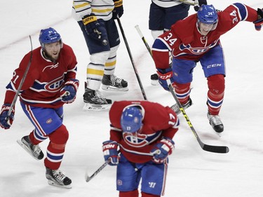 Stefan Matteau (left) and Michael McCarron (right) of the Montreal Canadiens happily chase after Torrey Mitchell who had just scored the go-ahead goal against the Buffalo Sabres in the third period of an NHL game at the Bell Centre in Montreal Thursday, March 10, 2016.