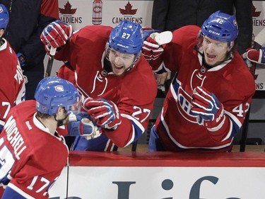Sven Andrighetto (right) and Alex Galchenyuk congratulate Torrey Mitchell who had just scored the go-ahead goal against the Buffalo Sabres in the third period of an NHL game at the Bell Centre in Montreal Thursday, March 10, 2016.