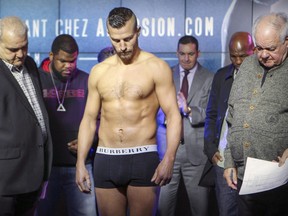 Uh-oh: David Lemieux looks down at the scale and gets bad news on March 11,2016, at the Casino de Montréal weigh-in for his fight with James De La Rosa, who subsequently pulled out of Saturday's  bout because Lemieux was too heavy.