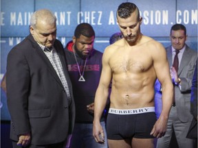 David Lemieux looks down at the scale at the Casino de Montréal for the weigh-in for his fight with James De La Rosa that was subsequently called off in Montreal on Friday, March 11, 2016.  The fight was cancelled when Lemieux was too heavy.