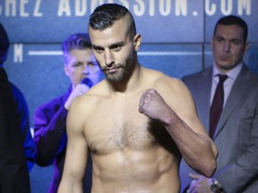 David Lemieux poses while stepping on the scale at the Casino de Montréal for the weigh-in for his fight with James De La Rosa that was subsequently called off in Montreal on Friday March 11, 2016.  The fight was cancelled when Lemieux was too heavy.
