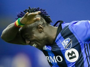 Montreal Impact forward Dominic Oduro celebrates after scoring against the New York Red Bulls during the second half of the Impact's home opening match at the Olympic Stadium in Montreal on Saturday, March 12, 2016.