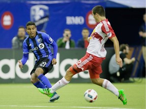 Impact midfielder Johan Venegas, left, chases the ball during the second half of the Impact's home opener against the New York Red Bulls at the Olympic Stadium in Montreal on Saturday, March 12, 2016.