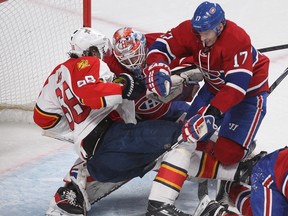 Florida Panthers' Jaromir Jagr (68) goes down over Montreal Canadiens goalie Mike Condon, while Torrey Mitchell (17) of the Montreal Canadiens gets in on the play, during second period NHL action in Montreal on Tuesday March 15, 2016.
