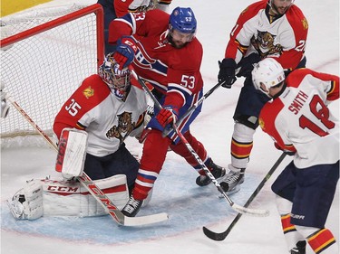 MONTREAL, QUE.: MARCH  15, 2016 -- Montreal Canadiens left wing Lucas Lessio (53) slides past Florida Panthers' Reilly Smith (18) and Vincent Trocheck (21), towards goalie Al Montoya, during first period NHL action in Montreal on Tuesday March 15, 2016. (Pierre Obendrauf / MONTREAL GAZETTE)