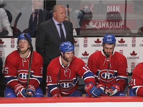Montreal Canadiens' Michel Therrien looks on following third period goal, by Florida Panthers' Aleksander Barkov, in NHL action in Montreal on Tuesday March 15, 2016. On the bench with Therrien are  Jacob De La Rose, Mike Brown, Lucas Lessio and Stefan Matteau.