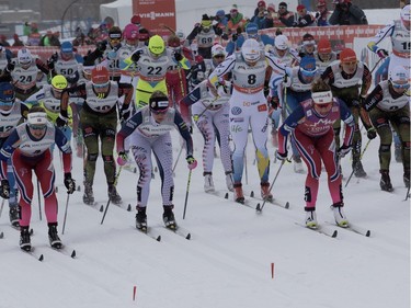 Maiken Caspersen Falla, centre, of Norway leads the pack during the FIS World Cup race in  Montreal on Wednesday March 2, 2016.