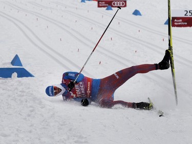 Sergey Ustiugov of Russia falls to the snow as he crosses the finish line during the FIS World Cup race in Montreal on Wednesday March 2, 2016. Ustiugov took 3rd place in the event.