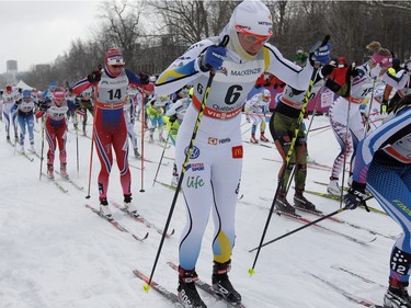 Seventy-two competitors from 18 countries sprint out of the start gate the pack during the FIS World Cup race in  Montreal on Wednesday March 2, 2016.
