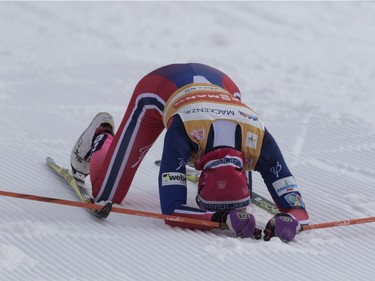 Therese Johaug of Norway falls to the track after crossing the finish line to win the FIS World Cup race in Montreal on Wednesday March 2, 2016.