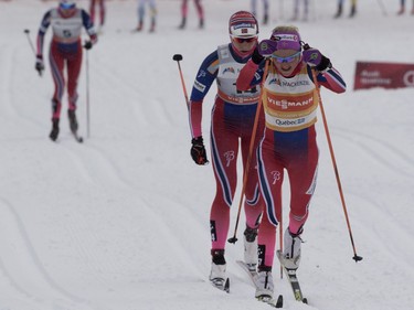 Therese Johaug of Norway leads the pack at the midway point as she goes on to win the FIS World Cup race in  Montreal on Wednesday March 2, 2016.