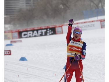 Therese Johaug of Norway lets out a scream as she crosses the finish line to win the FIS World Cup race in Montreal on Wednesday March 2, 2016.