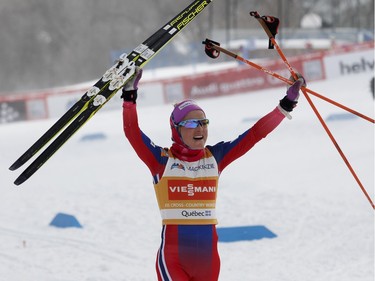 Therese Johaug of Norway lets out a scream as she crosses the finish line to win the FIS World Cup race in Montreal on Wednesday March 2, 2016.