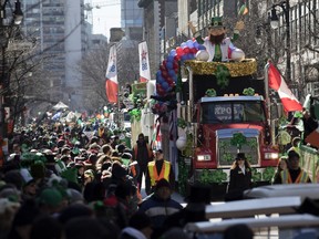 An Expos leprechaun rides atop the Expos Nation float during the annual St. Patrick's Parade on Sunday.