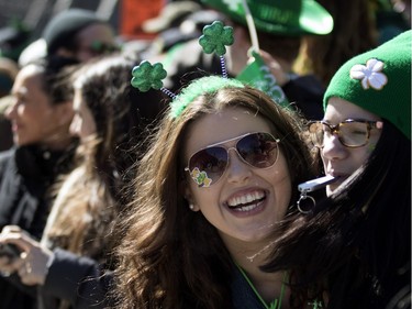 Thousands of people line Ste-Catherine St. to watch the annual St. Patrick's Parade in Montreal on Sunday, March 20, 2016.