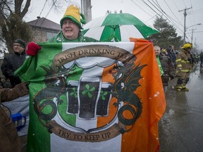 Frank Fitzgerald proudly holds his personal flag at the 6th annual St. Patrick's Day parade in Hudson, on Saturday, March 21, 2015. This year's parade in Hudson is set for Saturday, March 19. (Peter McCabe / MONTREAL GAZETTE)