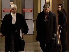 Daniel Gauthier, centre, leaves the courtroom with his lawyer Jean-Claude Hébert at the Montreal courthouse on Thursday March 24, 2016. Sûreté du Québec police officer Isabelle Toupin looks on.