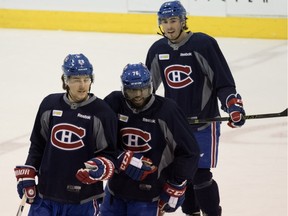 “Sometimes you doubt yourself the longer it takes," to get an NHL opportunity says Joel Hanley, top, with fellow Canadiens defencemen Nathan Beaulieu, left and P.K. Subban during a break from practice at the Bell Sports Complex in Montreal on Friday, March 25, 2016.