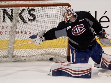 Canadiens goalie Mike Condon looks back in to the net after being scored on during a team practice at the Bell Sports Complex in Montreal on Friday March 25, 2016.