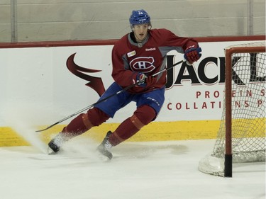 Canadiens' Michael McCarron, left, looks for a pass during a team practice at the Bell Sports Complex in Montreal on Friday March 25, 2016.