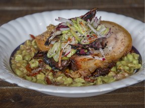 The superb porchetta at Tripes & Caviar is served atop a bed of herbed spaetzle with bits of oxtail.