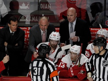 MONTREAL, QUE.: MARCH 29, 2016--  Detroit Red Wings head coach Jeff Blashill speaks with referee Trevor Hanson during NHL action at the Bell Centre in Montreal on Tuesday March 29, 2016. Blashill challenged a Canadiens goal and teh goal was reversed on review. Detroit Red Wings center Darren Helm and Detroit Red Wings center Pavel Datsyuk look on. (Allen McInnis / MONTREAL GAZETTE)