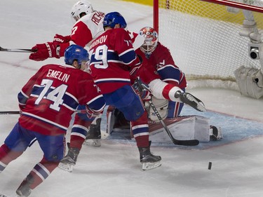 MONTREAL, QUE.: MARCH 29, 2016-- Montreal Canadiens goalie Mike Condon follows the puck as Detroit Red Wings center Brad Richards falls over him during NHL action at the Bell Centre in Montreal on Tuesday March 29, 2016. Montreal Canadiens defenseman Andrei Markov and Montreal Canadiens defenseman Alexei Emelin clear the puck. (Allen McInnis / MONTREAL GAZETTE)