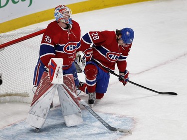 MONTREAL, QUE.: MARCH 29, 2016--  Montreal Canadiens goalie Mike Condon watches the replay as Montreal Canadiens defenseman Nathan Beaulieu reacts to the Detroit Red Wings tying the game 2-2 during NHL action at the Bell Centre in Montreal on Tuesday March 29, 2016. (Allen McInnis / MONTREAL GAZETTE)