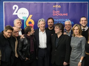 English singer and songwriter Roger Waters, centre, co-founder of Pink Floyd, poses for a photograph with the team from Opéra de Montréal during a press conference in Montreal to announce an opera adaptation of his famous album "The Wall".