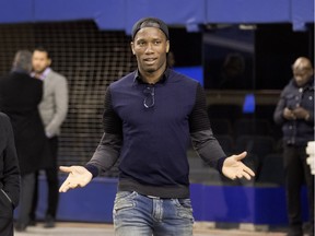 Montreal Impact player Didier Drogba reacts to seeing a large media pack gathered to speak with him in Montreal on Thursday March 3, 2016.
