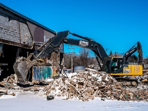 MONTREAL, QUE.: MARCH 3, 2016 -- The old shopping mall at the junction of Sources Blvd. and Highway 20 in Pointe-Claire, which has been abandoned for years, is being torn down on Thursday, March 3, 2016. (Dave Sidaway / MONTREAL GAZETTE)