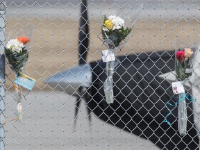 Flowers left in memory of pilot Pascal Gosselin on a fence outside the aviation company Aéro Teknic, of which he was president, in St-Hubert on Wednesday, March 30, 2016. Gosselin died in the plane crash in Îles-de-la-Madeleine that killed former MP Jean Lapierre along with four family members and the co-pilot.