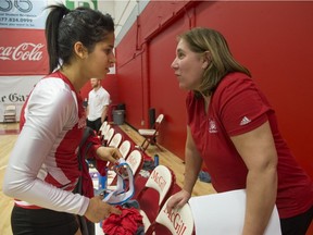 McGill volleyball team captain Yasmeen Dawoodjee speaks with head coach Rachèle Béliveau after the RSEQ Women's Volleyball Final at McGill University's Love Competition Hall in Montreal, on Saturday, March 5, 2016.