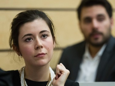 Catherine Fournier, who is part of the cabinet of Parti Québécois leader Pierre Karl Péladeau, not pictured, listens as Péladeau addresses students during an event organized for sovereignty week at the Universite de Montreal in Montreal on Monday, March 7, 2016.