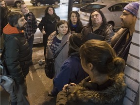 Emmanuel Sévigny (left/centre), a co-founder of Ciné-Club LaBanque talks to people, including Stephen Puskas (right, beside wall) outside the Ciné-Club in Montreal March 7, 2016.